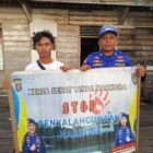 Anggota Ditpolairud Polda Kalteng Kapal Polisi XVIII-2002 mengampanyekan bahaya narkoba kepada masyarakat di Kabupaten Pulang Pisau, Sabtu, 9 Mei 2026.(Ist/Ditpolairud Polda Kalteng) 